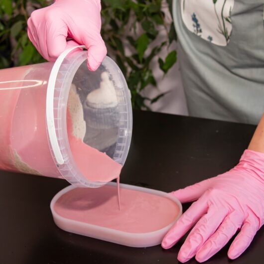 Photo of Jesmonite being poured into a silicone mould